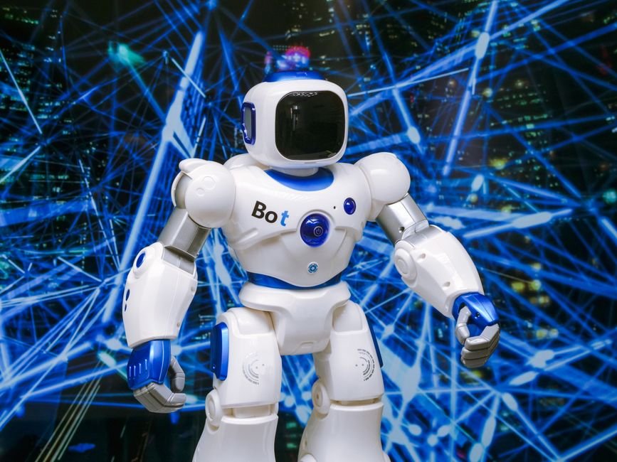 AI Manager Dismisses Human Worker in San Francisco Retail Experiment Advanced humanoid robot with glowing blue accents in a digital network setting.