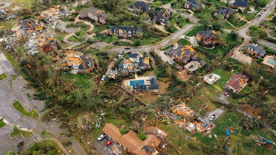Tornado and Waterspout Strike Long Island and Queens, Causing Damage and State of Emergency Aerial view of small settlement with destroyed houses and bent uprooted trees after hurricane