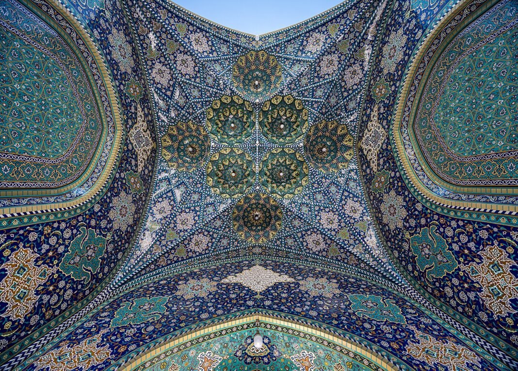 Iran Security Chief Issues Stark Warnings to Neighbors Amidst Mideast Tensions Bottom view of the iwan at one of the entrances at Fatima Masumeh Shrine, Qom, Iran. this picture merged from 25 pictures. 5 frames and each frame contain 5 pictures with 5 levels of exposure. HDR + …