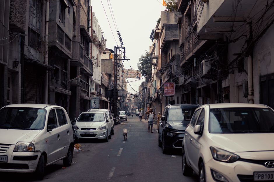 Ludhiana Police Announce Traffic Restrictions for Religious Event at Daresi Ground Busy street scene in Ludhiana, Punjab, showcasing urban life with cars and people.