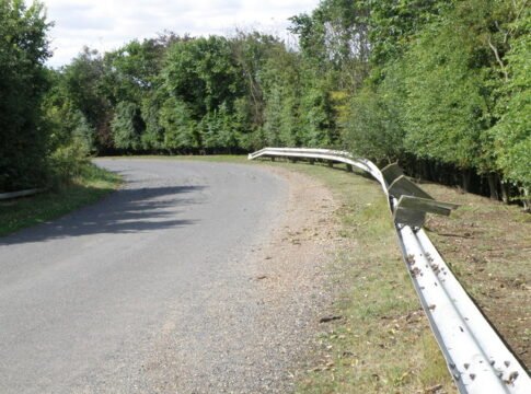 Collapsed Barriers, Low road near Little Stukeley The timber posts holding the crash barrier have all rotted away, both sides of the road and on both approaches to the flyover.