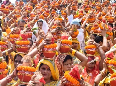Colorful cultural ceremony featuring women carrying Kalash at a temple festival in India. Colorful cultural ceremony featuring women carrying Kalash at a temple festival in India.
