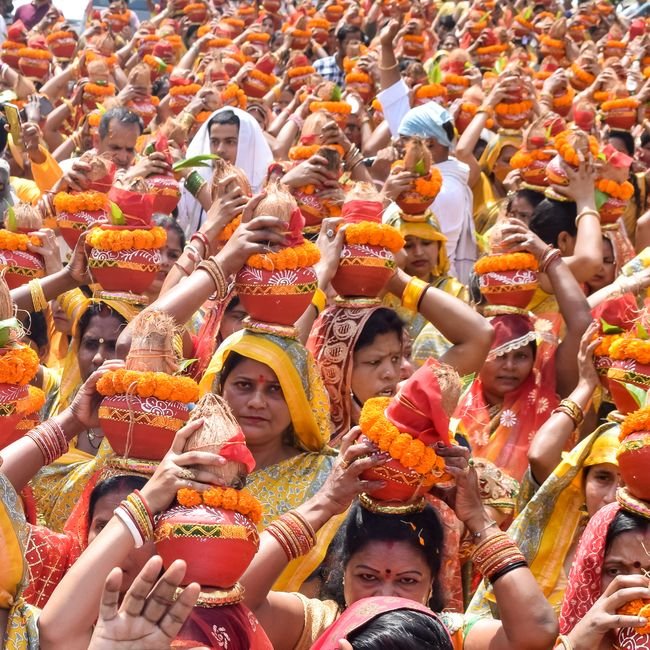 Delhi Residents Endure Sleep Deprivation, Noise Pollution Amidst Kanwar Yatra Camps Colorful cultural ceremony featuring women carrying Kalash at a temple festival in India.