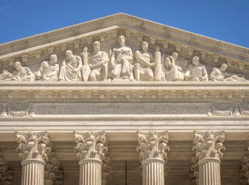 Detailed view of the Supreme Court Building's frontal frieze depicting historical figures and justices. Detailed view of the Supreme Court Building's frontal frieze depicting historical figures and justices.