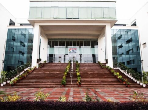 Elegant facade of a government building in Lucknow, Uttar Pradesh with prominent staircase and glass windows. Elegant facade of a government building in Lucknow, Uttar Pradesh with prominent staircase and glass windows.