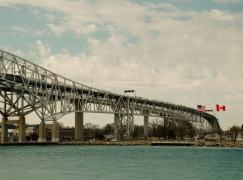 Iconic Blue Water Bridge spanning between the USA and Canada over clear waters.