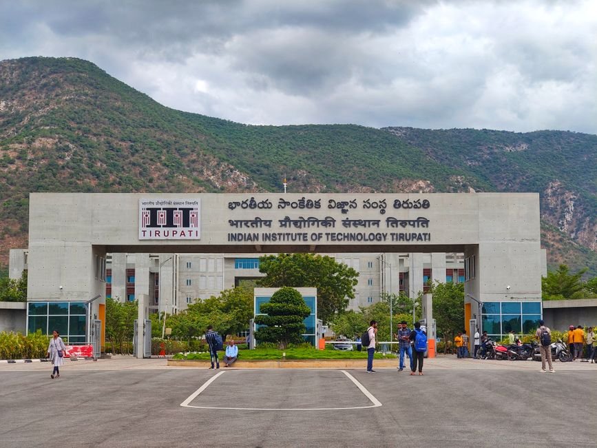Main entrance of Indian Institute of Technology Tirupati with scenic mountains in background.