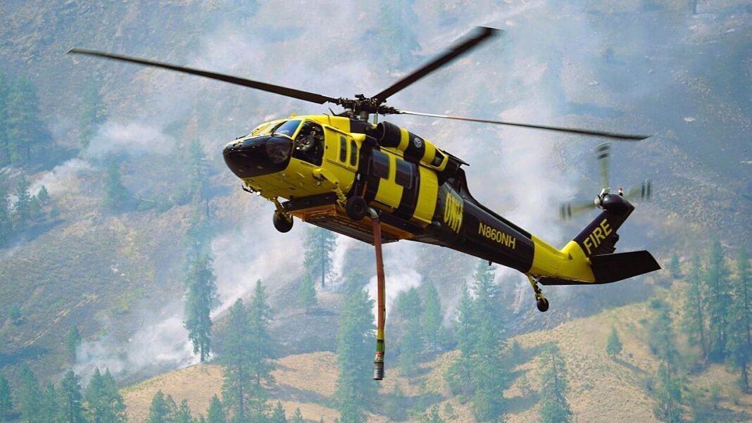 Hawk Fire Explodes to Over 10,000 Acres Near Reno, Triggering Evacuations Northwest Helicopters Sikorsky UH-60A Black Hawk firefighting helicopter, "Bumblebee" working with the incident team fighting the Sinlahekin Fire,