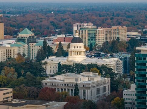 Stunning aerial view of the iconic California State Capitol in Sacramento surrounded by cityscape. Stunning aerial view of the iconic California State Capitol in Sacramento surrounded by cityscape.