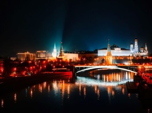 Stunning night view of Moscow's illuminated skyline with reflections on the river. Stunning night view of Moscow's illuminated skyline with reflections on the river.