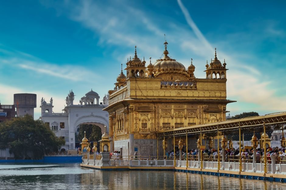 Moga Engineer Wins Rs 1.5 Crore Punjab Lottery, Returns to Gurdwara to Express Gratitude Stunning view of the Golden Temple in Amritsar, India, gleaming under the bright sky.