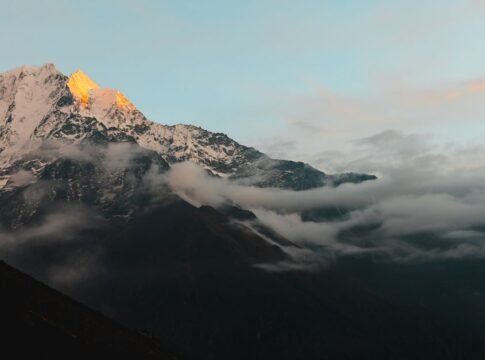 Stunning view of the Himalayan mountains in Nepal during sunrise, with cloud cover adding drama. Stunning view of the Himalayan mountains in Nepal during sunrise, with cloud cover adding drama.