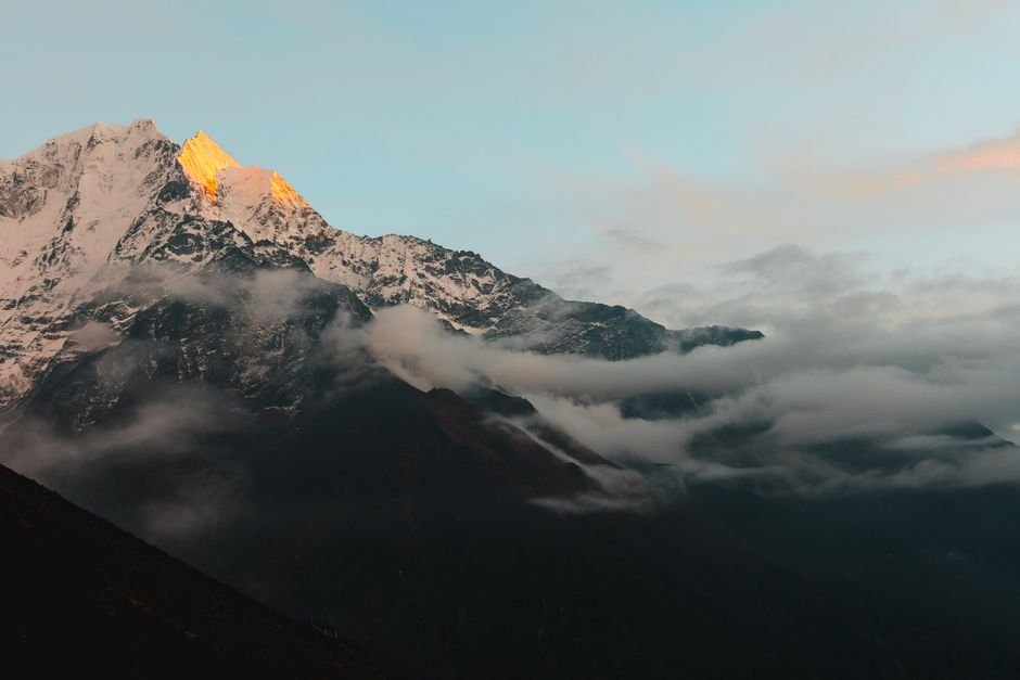 Nepal-Tibet Flash Floods Death Toll Reaches 392, Thousands Missing Amid New Flood Threat Stunning view of the Himalayan mountains in Nepal during sunrise, with cloud cover adding drama.