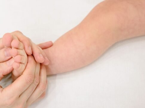 Tender infant foot massage providing soothing comfort and care.