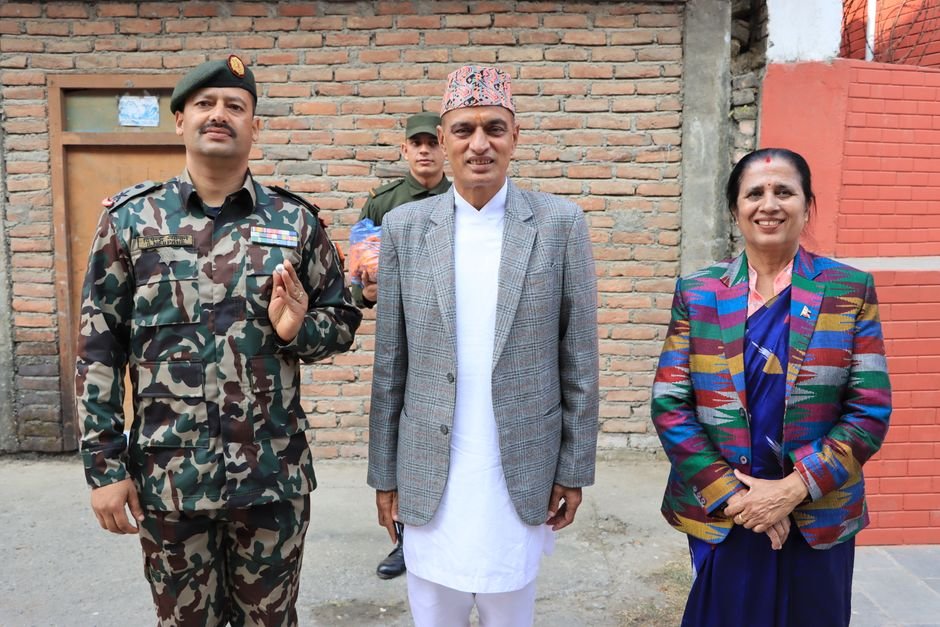 Colonel Grewal Awarded Yoddha Seva Samman at Western Command Ceremony Three adults, including two men and one woman, standing together outdoors in formal attire.