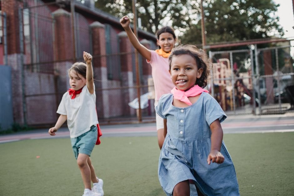 Himachal Pradesh: 35 Children Hospitalised After Consuming Mid-Day Meal Kheer in Kullu Three children enjoying a playful competition at an outdoor playground, showcasing motion and joy.