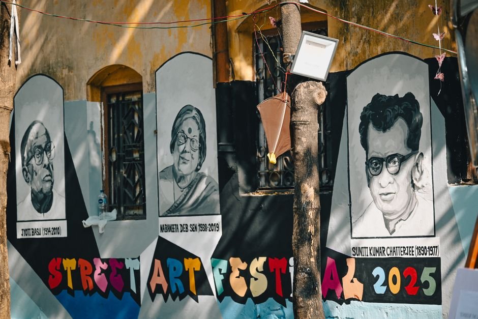 Uttar Pradesh Brothers Embark on 200-km Kanwar Journey Carrying Parents Vibrant street art mural depicting famous figures at a festival in Kolkata, India.