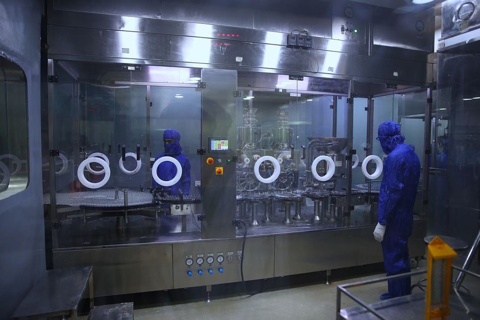 Punjab Clears Mountains of Garbage as Sanitation Workers End Strike Workers in protective gear inside a sterile pharmaceutical manufacturing plant in Rawalpindi, Pakistan.