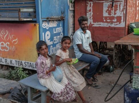 A candid street scene featuring people outside a tea stall in Kanchipuram, Tamil Nadu. A candid street scene featuring people outside a tea stall in Kanchipuram, Tamil Nadu.