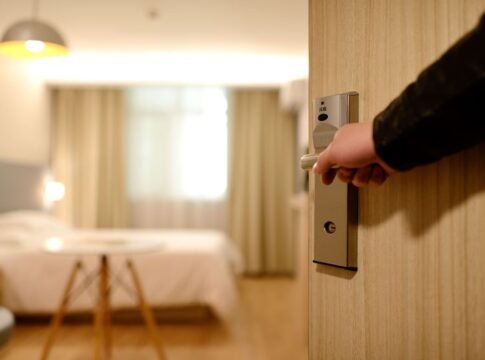 A soft-lit hotel room entrance, welcoming guests with luxury appeal and comfort. A soft-lit hotel room entrance, welcoming guests with luxury appeal and comfort.