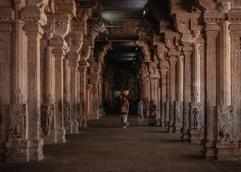 Tamil Nadu Braces for Intensified Rainfall in Interior Regions A stunning view of an intricately designed temple corridor in Tiruchirappalli, showcasing traditional Dravidian architecture.