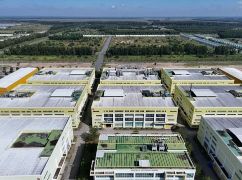 Aerial shot of a modern industrial complex surrounded by greenery in Bình Dương, Vietnam.