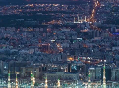Aerial view of contemporary big metropolis illuminated with glowing city lights at night Aerial view of contemporary big metropolis illuminated with glowing city lights at night
