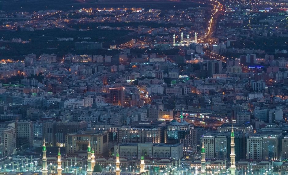 Saudi Arabia Intercepts Six Houthi Ballistic Missiles Targeting Taif and Yanbu Aerial view of contemporary big metropolis illuminated with glowing city lights at night