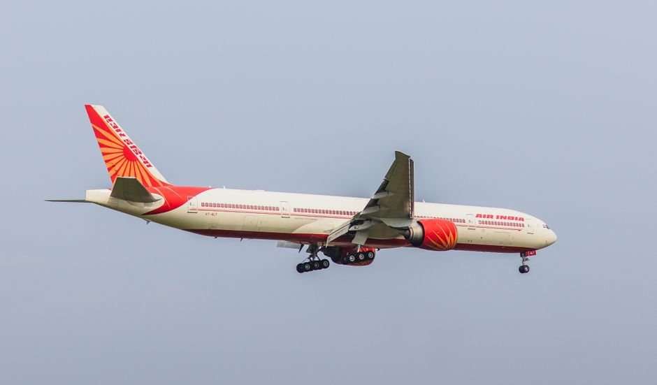 Air India Sacks Pilot-in-Command of Phuket-Delhi Flight After Drug Test Air India Boeing 777 captured in clear sky during flight approach. Perfect aviation stock image.