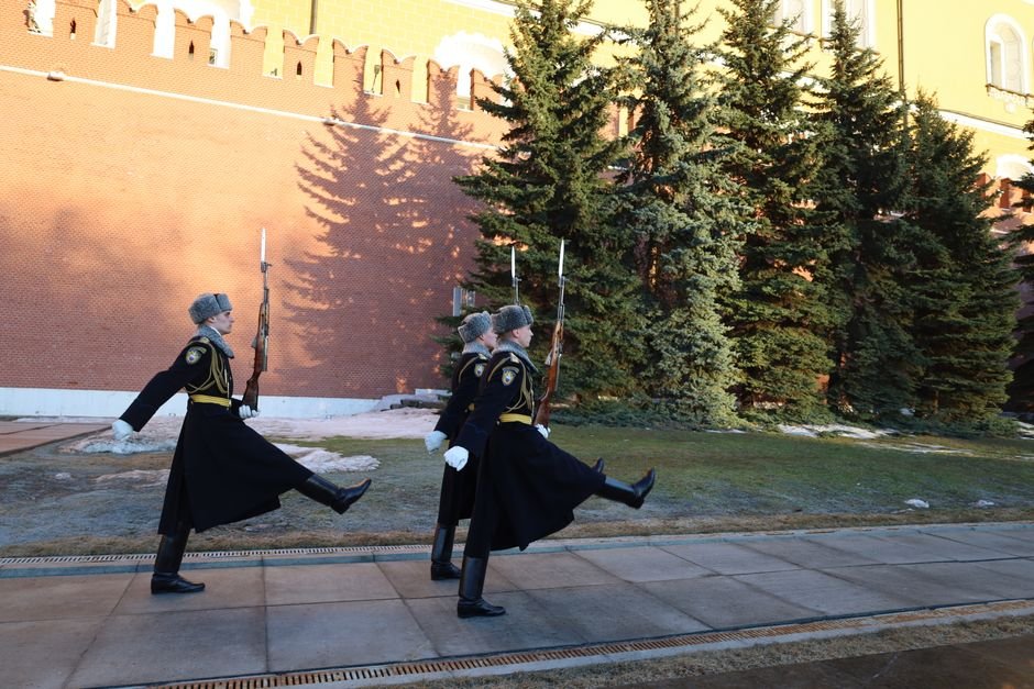 Kushner and Witkoff Meet Putin in Moscow for Ukraine War Discussions Ceremonial guards march outside the Kremlin walls in Moscow on a bright day.