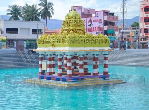 Colorful temple pavilion in a reflecting pool with traditional architecture. Colorful temple pavilion in a reflecting pool with traditional architecture.