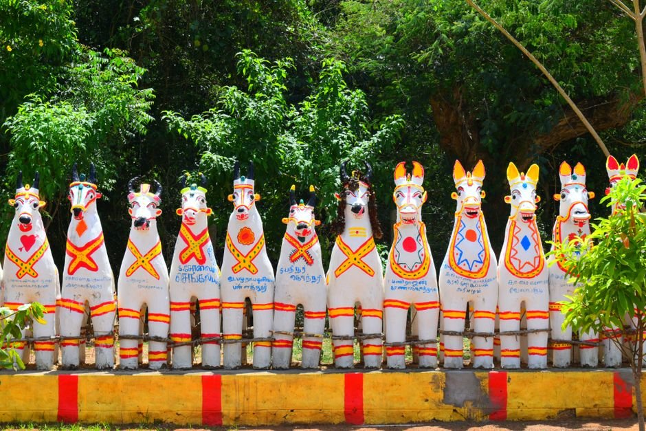 Dakshina Chitra Museum: A Living Testament to South Indian Heritage Colorful terracotta horse statues displayed outdoors in Karaikudi, Tamil Nadu, reflecting local culture.