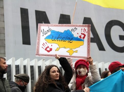 Demonstrators rally for Ukraine in Vancouver, holding signs and flags during a peaceful protest. Demonstrators rally for Ukraine in Vancouver, holding signs and flags during a peaceful protest.
