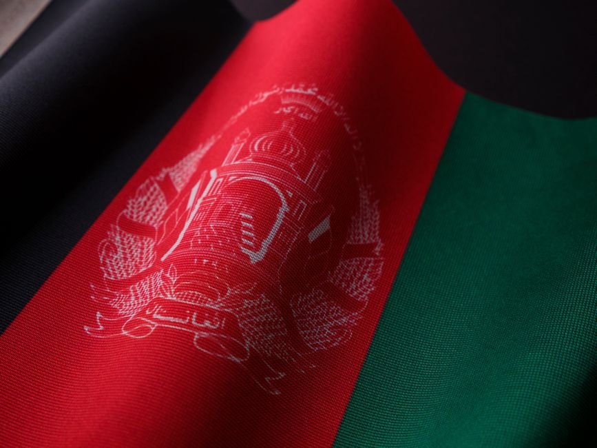 India, Afghanistan Joint Working Group Boosts Bilateral Trade and Economic Ties Detailed photograph of the Afghan flag showcasing its vibrant colors and emblem. Perfect for cultural and political themes.