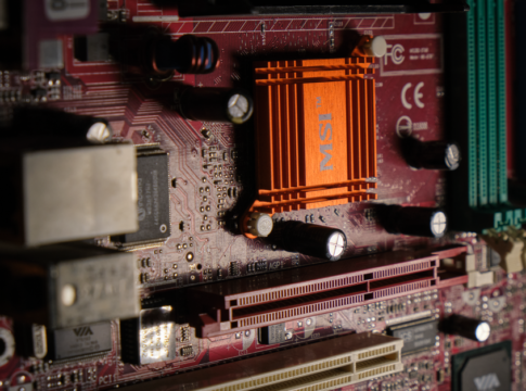 Detailed view of a computer motherboard showcasing intricate electronic components. Detailed view of a computer motherboard showcasing intricate electronic components.