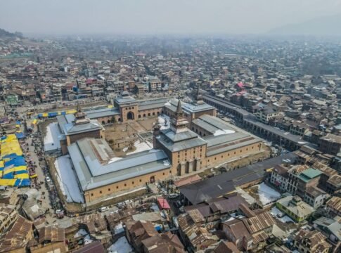 Drone shot of Jamia Masjid in Srinagar showcasing its architectural design amidst the cityscape. Drone shot of Jamia Masjid in Srinagar showcasing its architectural design amidst the cityscape.