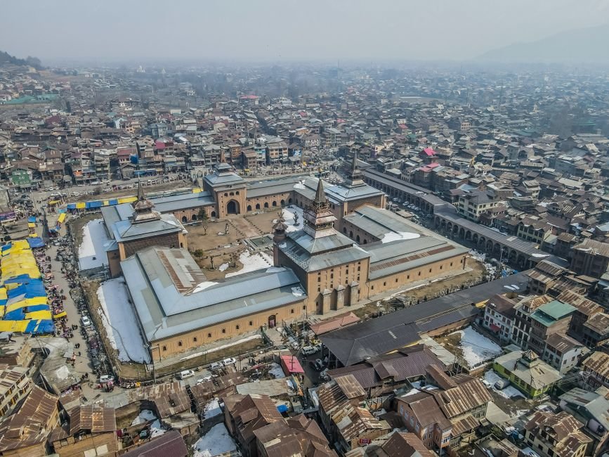 Jammu and Kashmir Assembly Set to Convene for Seven-Day Autumn Session Drone shot of Jamia Masjid in Srinagar showcasing its architectural design amidst the cityscape.