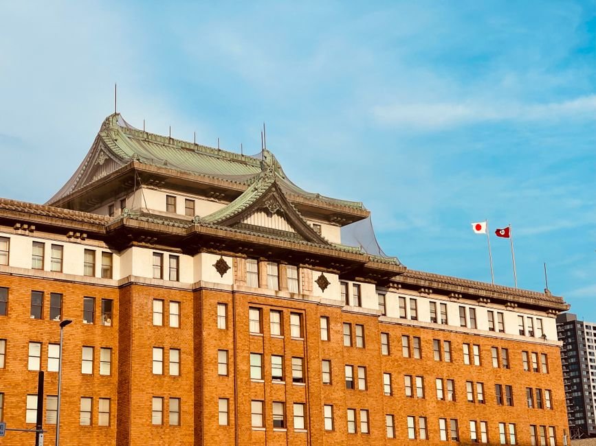 Japan to Host Key Asia-Pacific Disaster Risk Reduction Conference in 2027 Historic government building facade in Nagoya showcasing imperial crown style architecture under a bright blue sky.