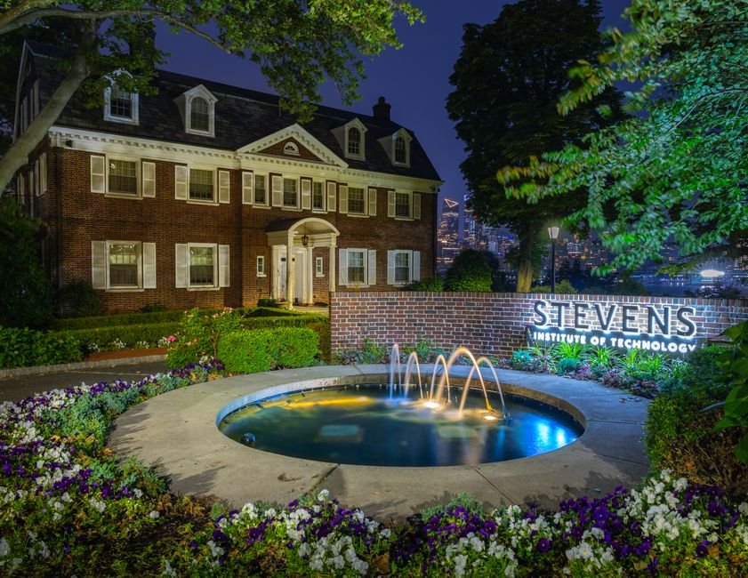 New Jersey Institute of Technology Advances Disaster Resilience Research and Community Support Illuminated view of Stevens Institute of Technology with a fountain at night, Hoboken, NJ.