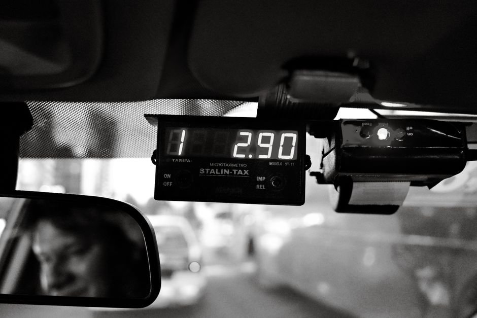 Tamil Nadu: Historical Debate Over M.K. Stalin’s 1976 Detention Under MISA Re-examined Moody black and white image of a taxi meter displaying fare inside a moving vehicle.