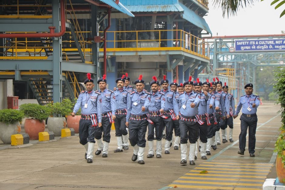 Central Delhi: CISF Deployed to Secure National Testing Agency Headquarters Security personnel in uniform performing a synchronized march at an industrial facility.
