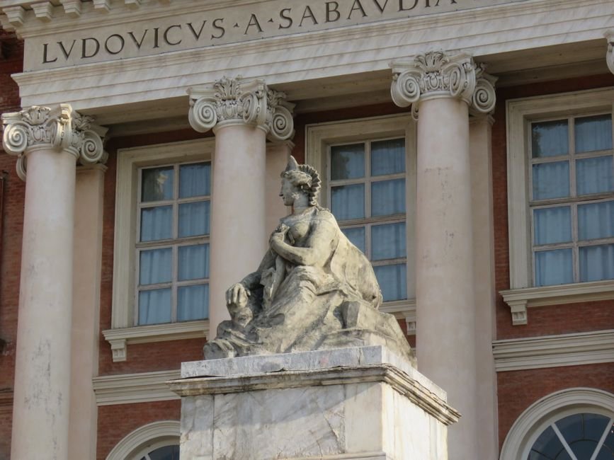 Elsevier Journal Focuses on Interdisciplinary Sustainability Research Stone statue with classic architecture in Turin, Italy.