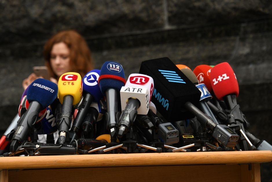 Media Outlets Sue Trump Administration Over White House Press Credentials Various microphones setup at a press conference in Kyiv, Ukraine.