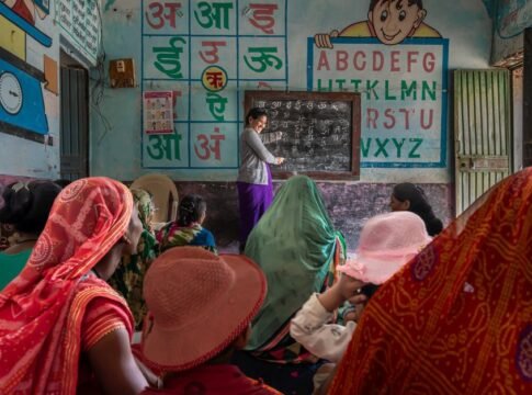 Women attending an educational session in a rural Indian classroom, promoting inclusivity and empowerment. Women attending an educational session in a rural Indian classroom, promoting inclusivity and empowerment.