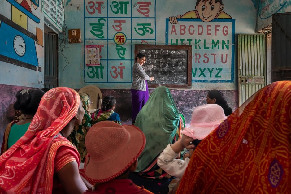 Himachal Pradesh Educator Transitions from Classroom to Teacher Mentorship in Kinnaur Women attending an educational session in a rural Indian classroom, promoting inclusivity and empowerment.