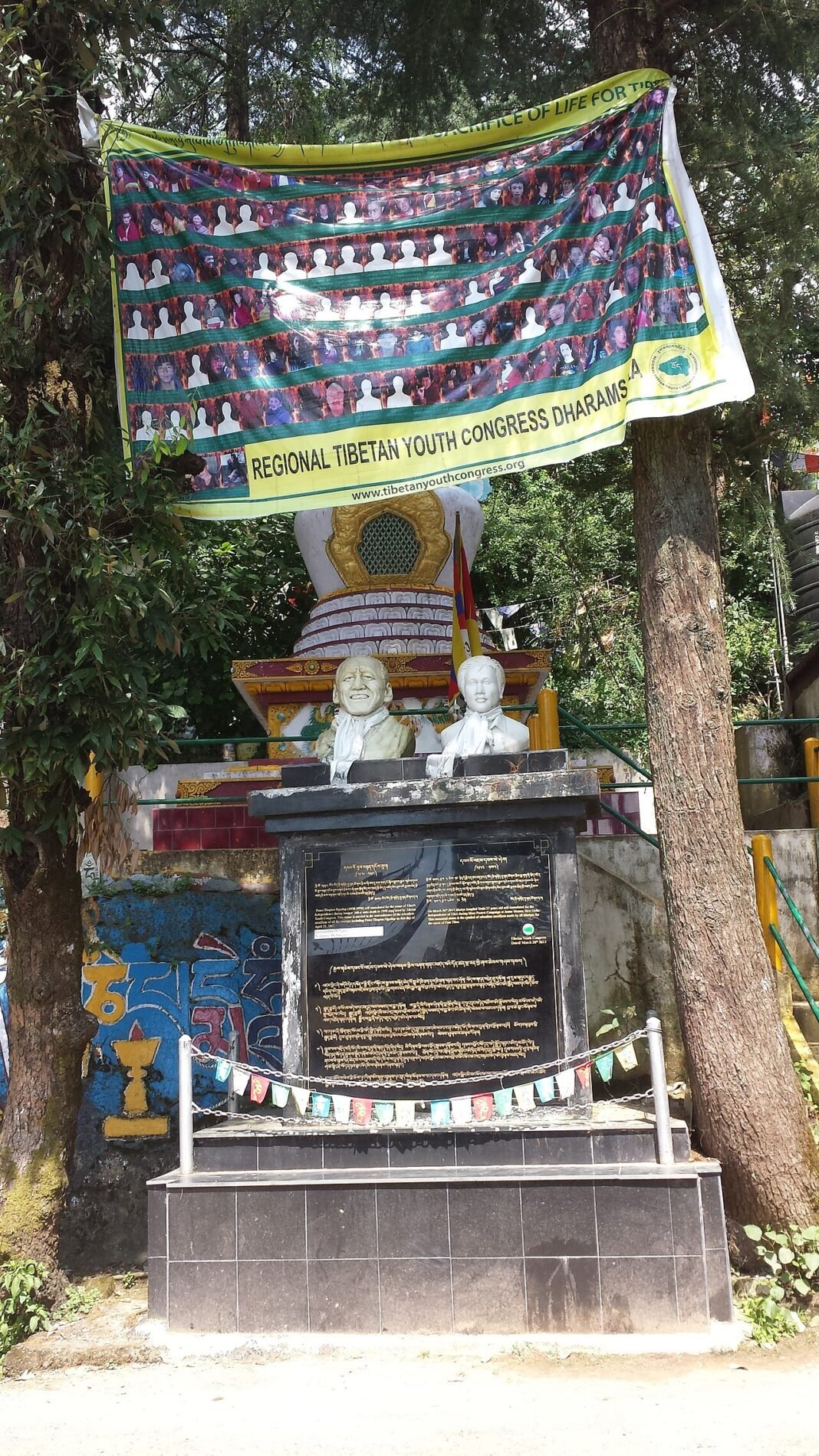 Tibetan Youth Congress Condemns Restrictions on Nagchu Earthquake Relief Efforts A banner of the Regional Tibetan Youth Congress Dharamsala hanging above a statue in McLeod Ganj, India, in September 2014.