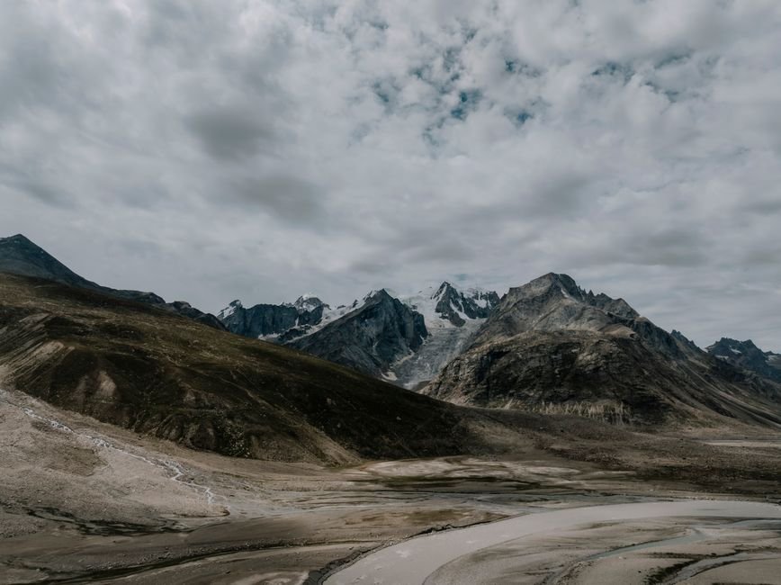 Himachal Pradesh: Lahaul Seeks Spiritual Hub Status for Chandrabhaga River Confluence A breathtaking aerial view of the rugged Spiti Valley mountains in Himachal Pradesh, India.