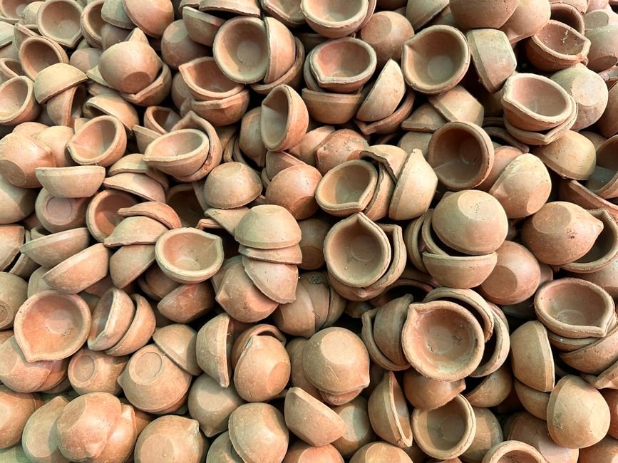 Jammu and Kashmir: Artisans Craft Earthen Diyas in Srinagar Ahead of Diwali A collection of traditional terracotta diyas, commonly used in Indian festivals like Diwali.