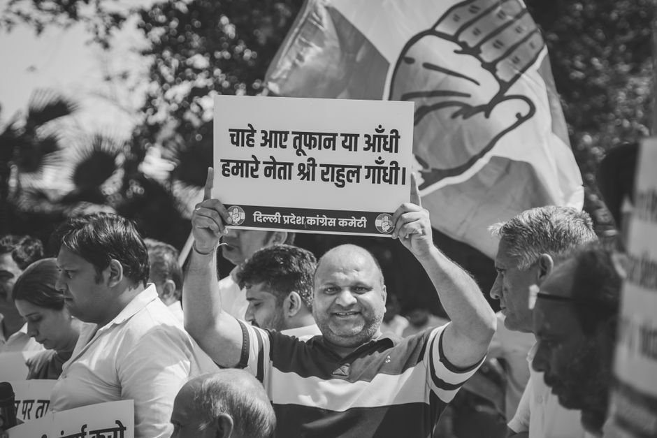 Uttar Pradesh: Caste-Based Gatherings Emerge as Polls Near A group of protesters holding signs at a demonstration, captured in black and white.