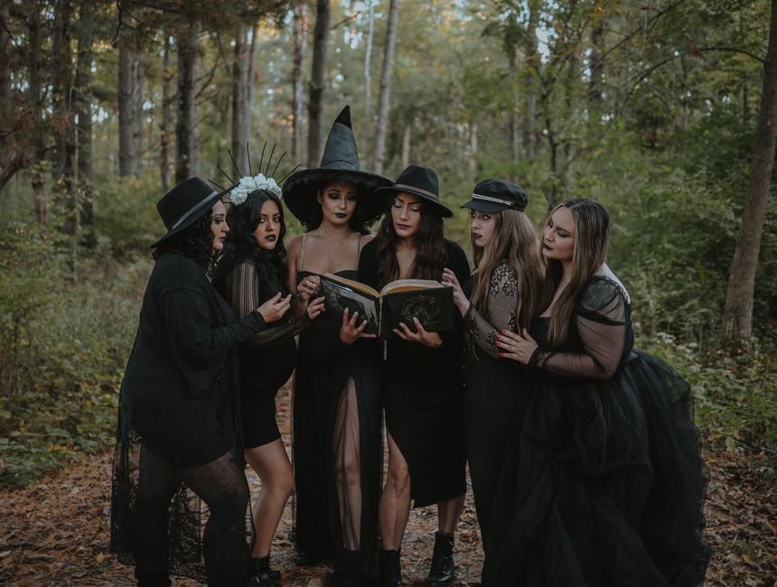 The Coven Acquires Rights to Slasher Film ‘The Only One’ Ahead of Brooklyn Horror Fest Premiere A group of women in witch costumes reading a spell book amidst an enchanting forest.